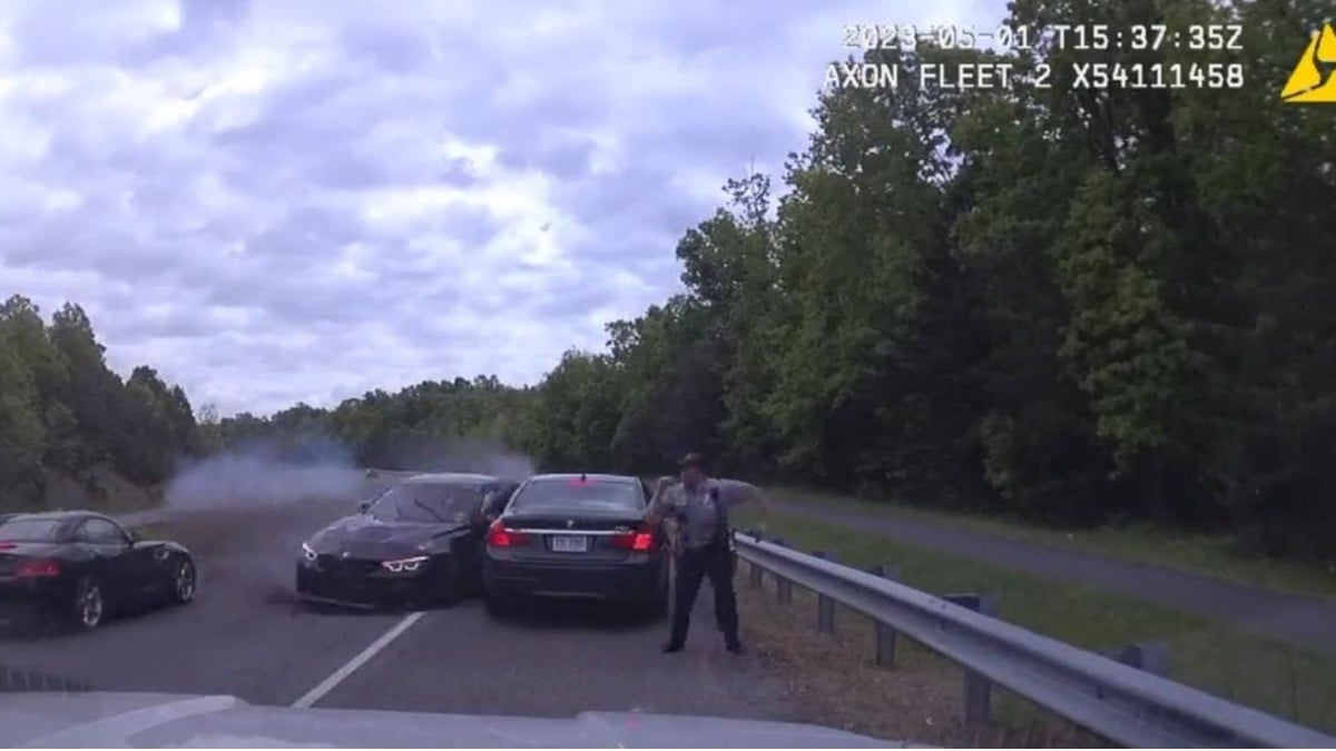 ¡Policía se salva de ser aplastado por un vehículo!
