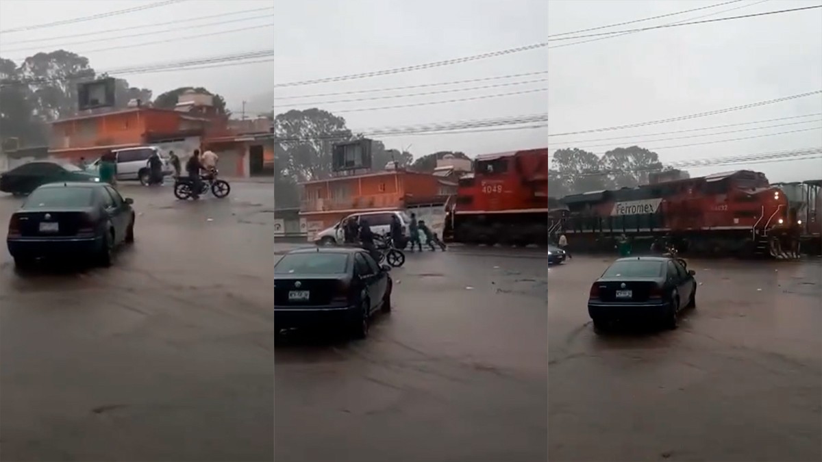 VIDEO ¡Por un pelito! Héroes salvan a familia empujando su camioneta atorada en las vías