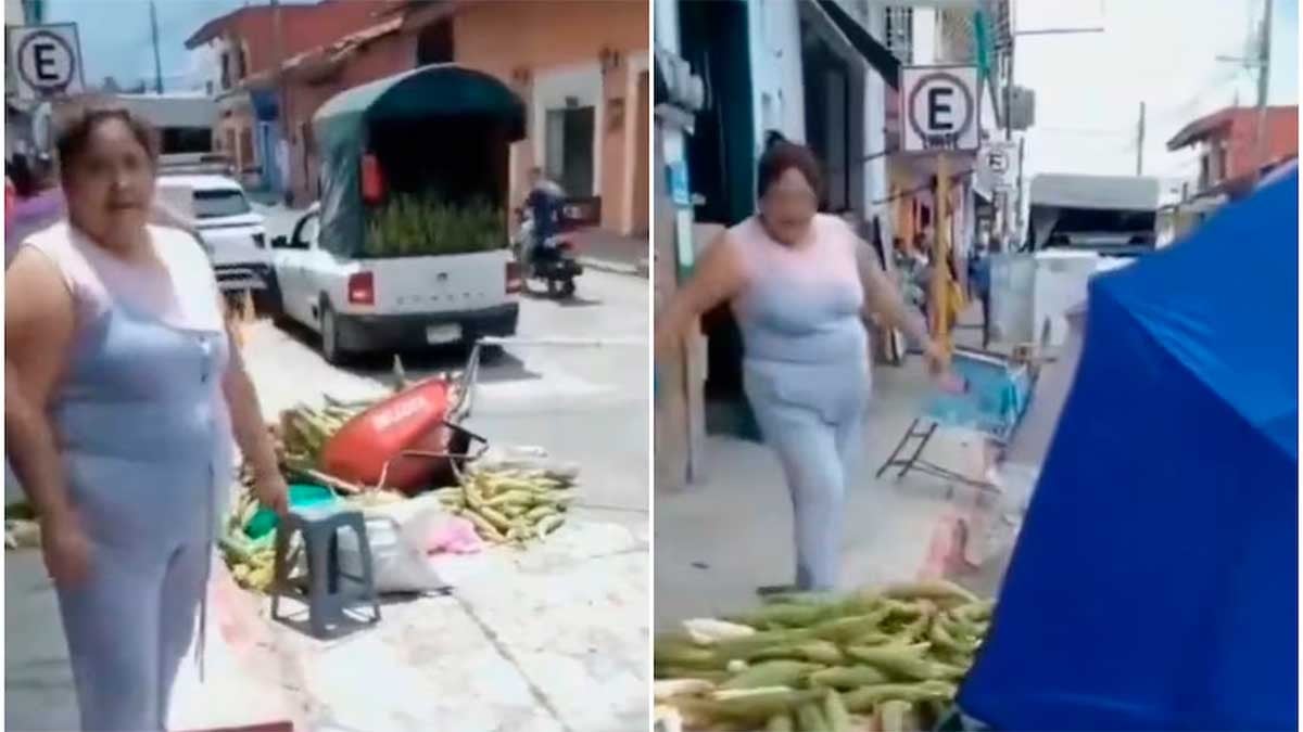 VIDEO Enojada porque le tapaba su negocio, mujer tira carretilla con elotes y es viral