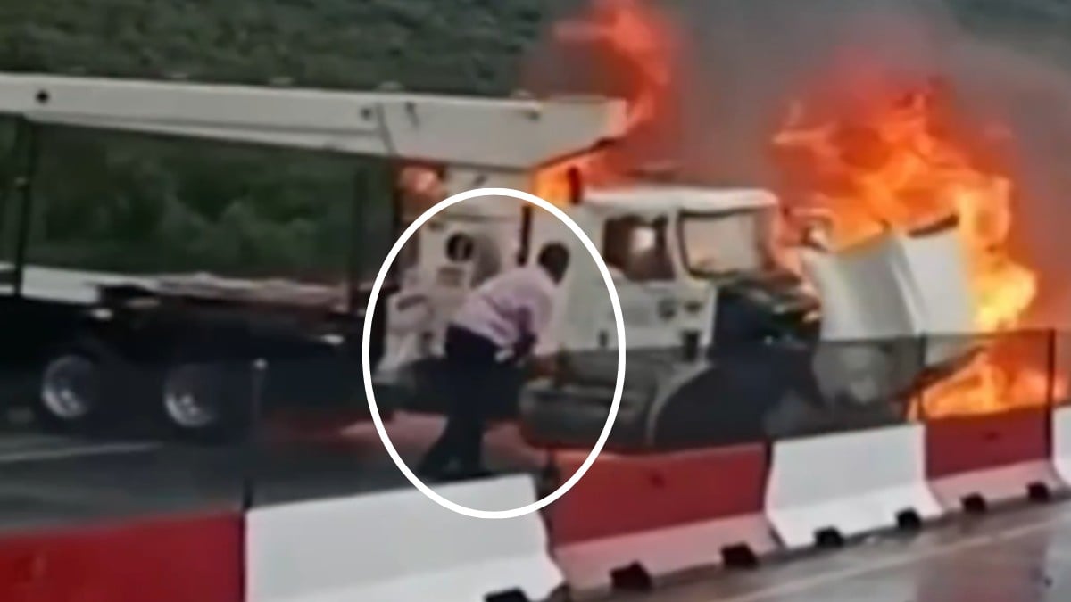VIDEO Hombre desesperado hace todo para evitar ser arrollado por una grúa en llamas